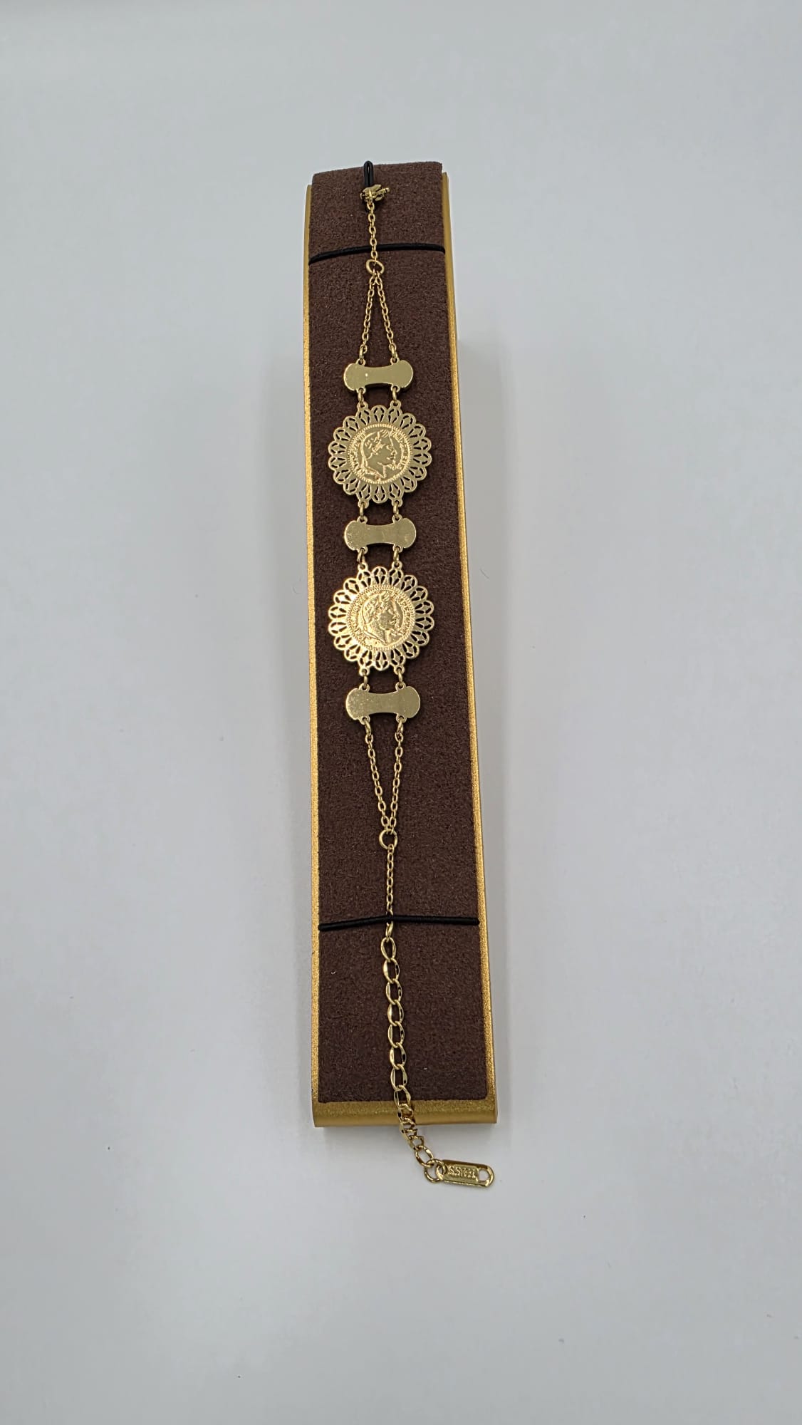 Gold coin tennis bracelet