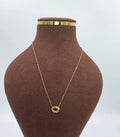 Gold Necklace with Abstract Circular Pendant